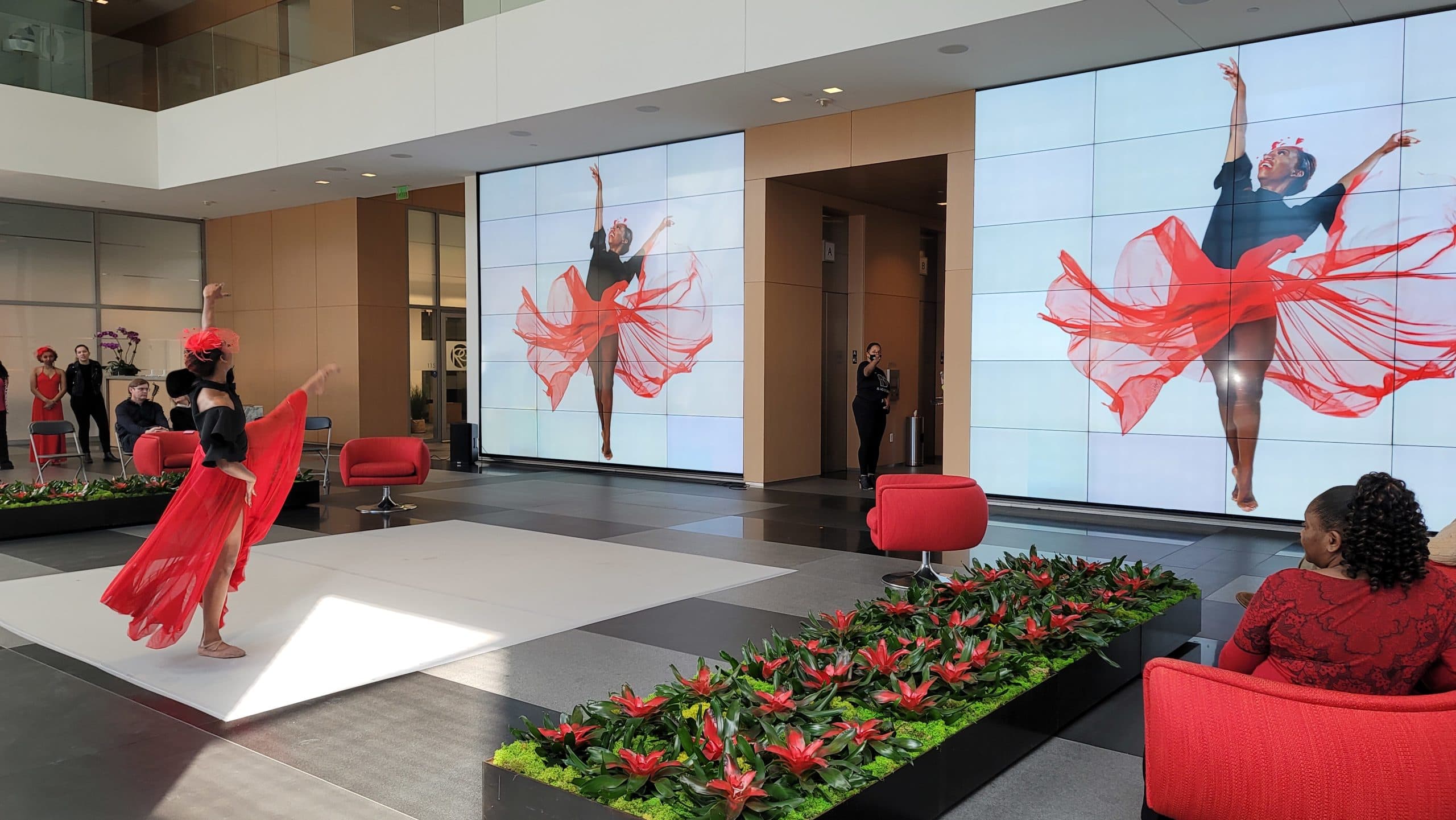 Lobby of One Arts Plaza with digital art screens