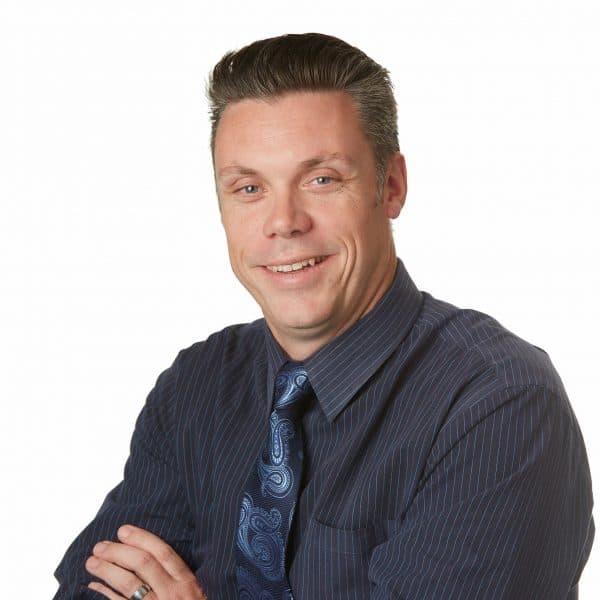 Portrait of John Gardiner, SVP of Comm. Development